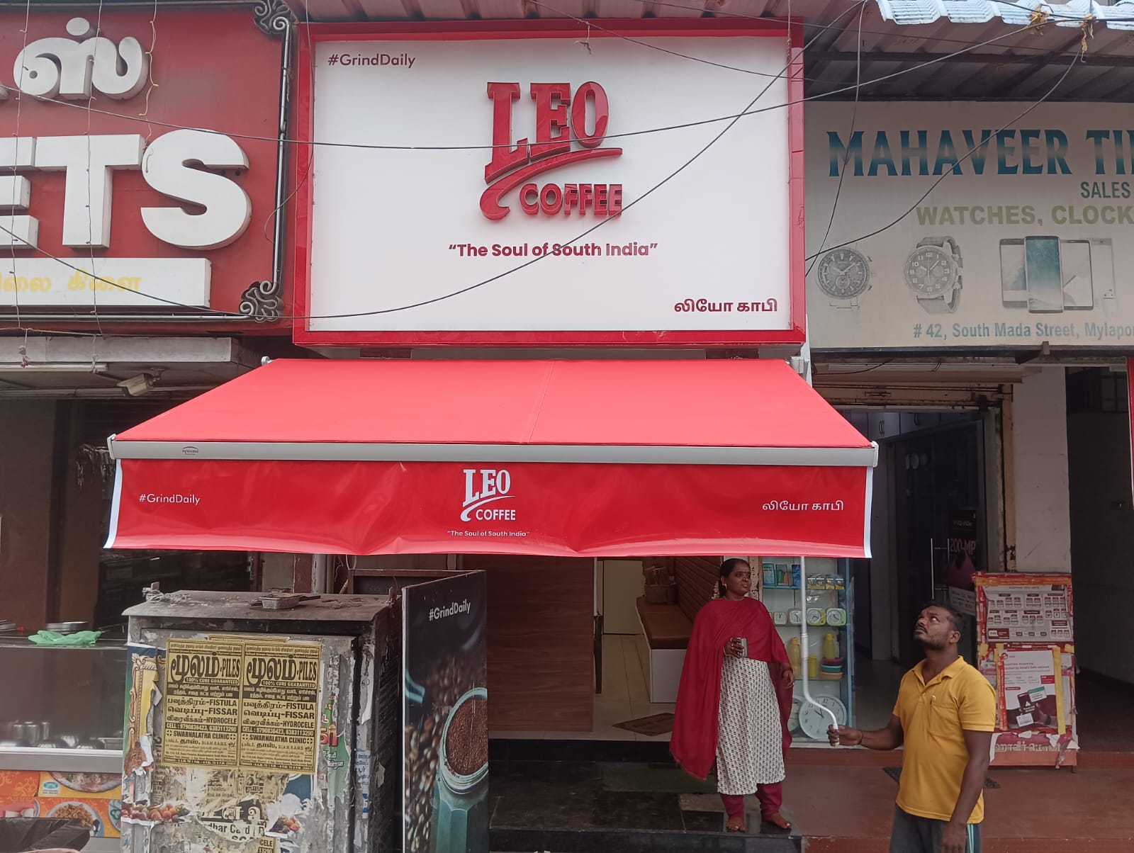 Retractable Awnings at shop entrance image